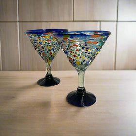 Confetti Rock Martini Glass with Blue Rim | Hand-Blown Mexican Barware - hand-blown pebble martini glass with blue rim and colorful confetti dots