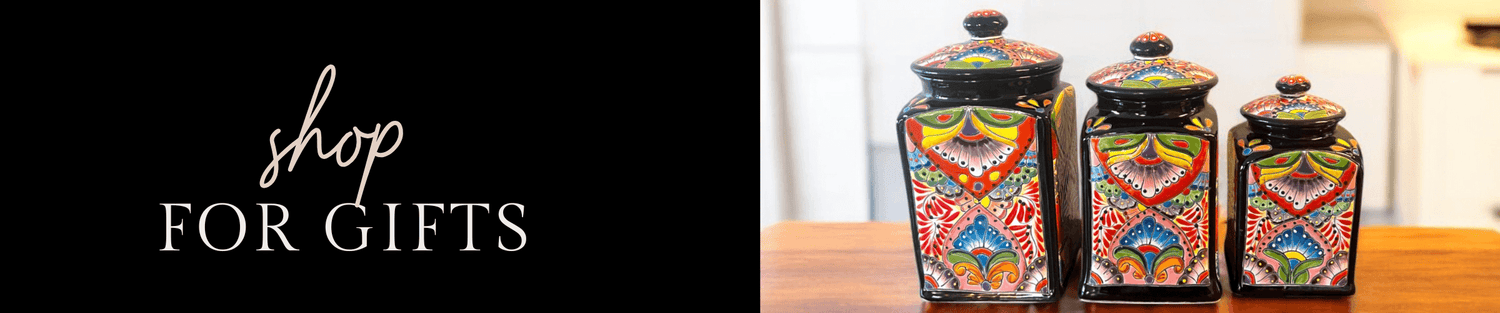 Set of three colorful hand-painted ceramic gift jars on wooden table, decorative kitchen storage perfect for gifts and home decor