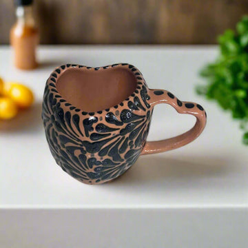 Black Talavera Heart Mug – Slightly Imperfect & Handmade hand-painted black and clay heart-shaped mug with decorative floral pattern