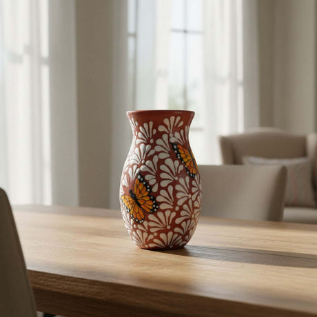 The Talavera Hub brown and white ceramic vase with monarch butterfly relief design, 9.5" tall.