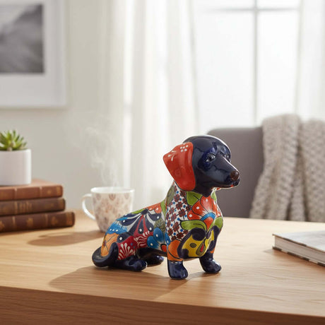 The Talavera Hub colorful ceramic dachshund figurine with floral patterns in blue, orange, red, and green.