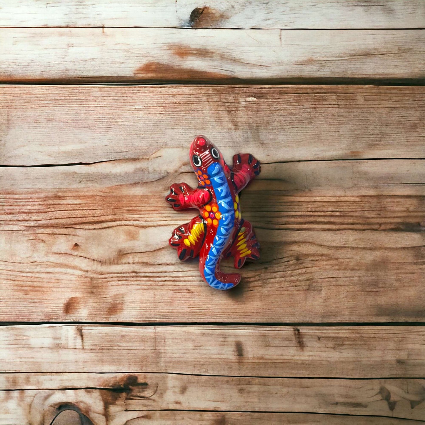 Guerrero Iguana Figurine | Colorful Hand-Painted Mexican Folk Art - hand-painted Talavera-style iguana on wooden background