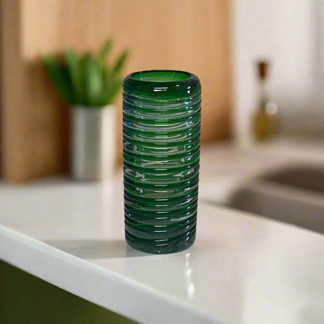 Mexican Double Shot Glass | Hand-Blown Green Swirl Barware - handcrafted ribbed green cylindrical double shot glass on kitchen counter