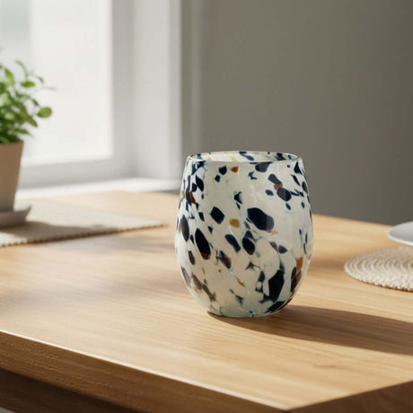 The Talavera Hub hand-blown stemless wine glass with blue, mocha, and white speckles. Holds 12 oz.