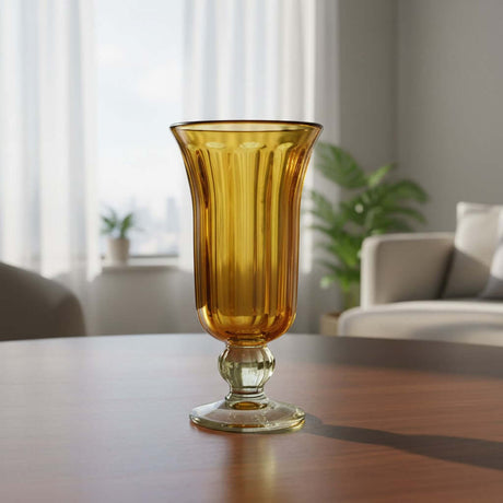 The Talavera Hub hand-blown amber glass sundae dish with ribbed texture and flared rim, 7" tall.