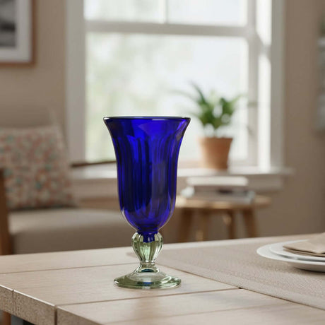 The Talavera Hub hand-blown cobalt blue glass sundae dish with a clear stem and base. 7" tall.
