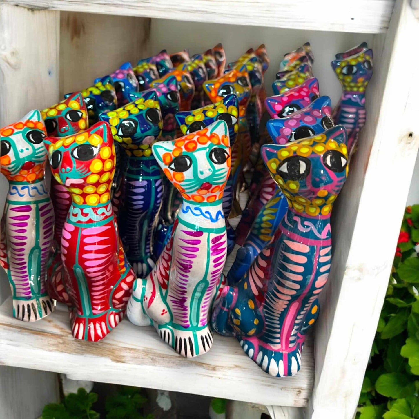 Hand-Painted Guerrero Cat Statue | Colorful Mexican Ceramic Figure (Medium) displayed grouped hand-painted Talavera-style ceramic cats on shelf