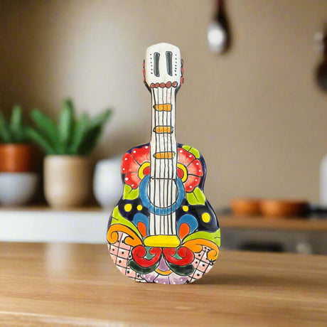 Talavera Guitar Statue | Hand-Painted Mexican Folk Art Decor - vibrant hand-painted Talavera guitar sculpture with floral geometric patterns