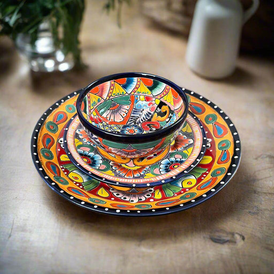 Handmade Talavera 12-Piece Dinnerware Set | Mexican Pottery for 4 — vibrant hand-painted Talavera plates and bowl set on wooden table