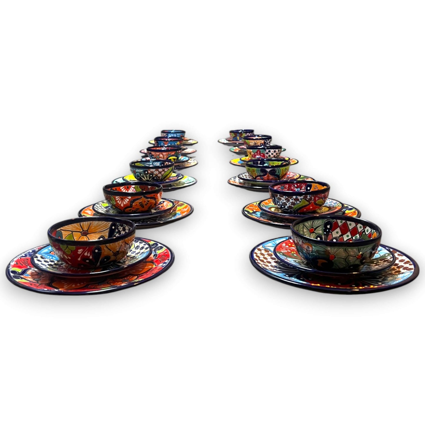 36-Piece Talavera Dinnerware Set | Handmade Mexican Plates & Bowls - hand-painted colorful Talavera bowls and plates arranged in two rows