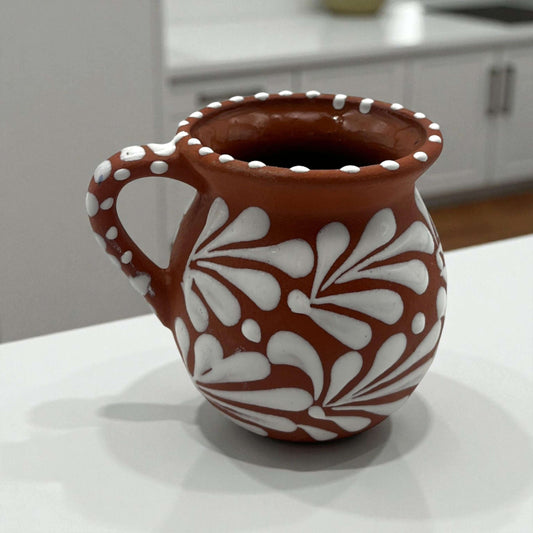 Terracotta Jarrito Mug | Handmade Mexican Relief Pottery Cup - handcrafted terracotta mug with white raised floral relief and dotted rim, kiln-fired glazed