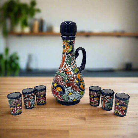 Talavera Decanter with 6 Shot Glasses | Hand Painted Mexican Set - hand-painted floral Talavera decanter and six matching shot glasses on wooden table
