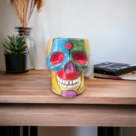 Mexican Handcrafted Skull Planter | Unique Small Flower Pot for Home Decor - hand-painted colorful Talavera skull planter on wooden shelf