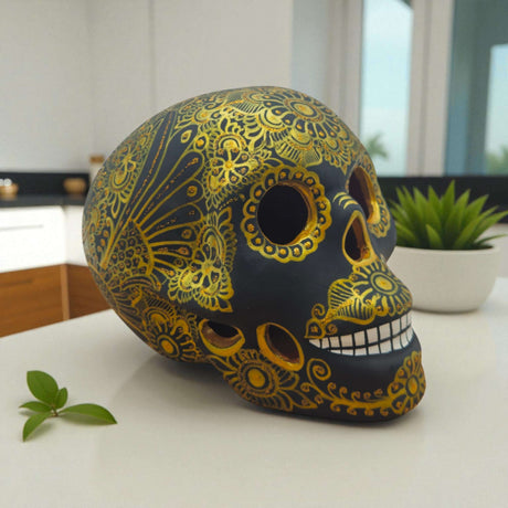 Talavera Calavera Skull | Hand-Painted Ceramic Decor black skull with intricate gold floral motifs, handcrafted in Guanajuato, Mexico