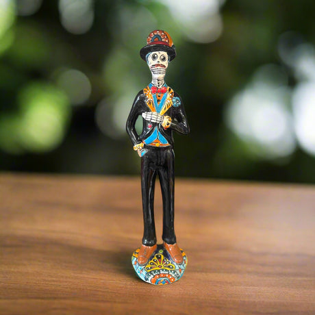 Talavera Catrin Statue | Hand-Painted Day of the Dead Skeleton Man - hand-painted Talavera skeleton gentleman in black suit with colorful accents