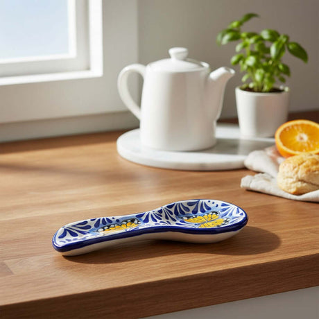 The Talavera Hub blue and white ceramic spoon rest with monarch butterfly motif and floral accents.