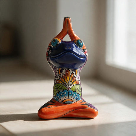 Front view of a colorful Talavera yoga frog statue in a lotus pose