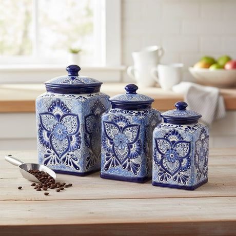 The Talavera Hub handmade blue and white ceramic canister set with traditional floral patterns on a wooden table.