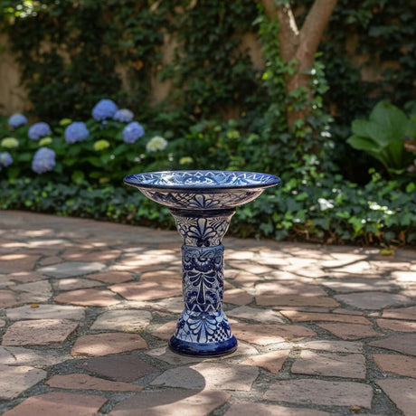 The Talavera Hub blue and white ceramic Talavera bird bath with floral motif, 27" tall, 18" diameter.