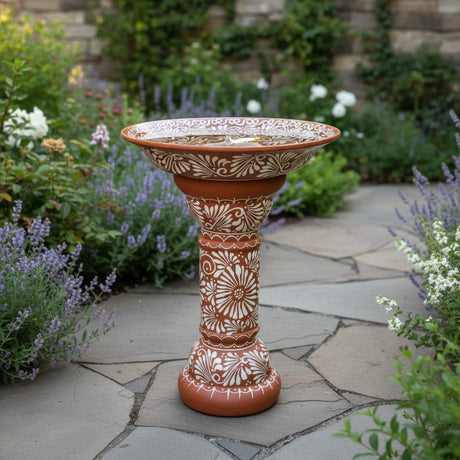 The Talavera Hub brown and white ceramic bird bath with intricate floral motifs, handcrafted in Mexico.