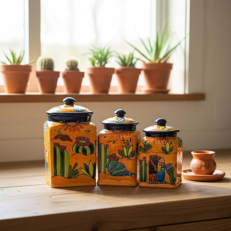The Talavera Hub handmade ceramic Talavera canister set with desert motifs in orange, blue, green, and yellow.