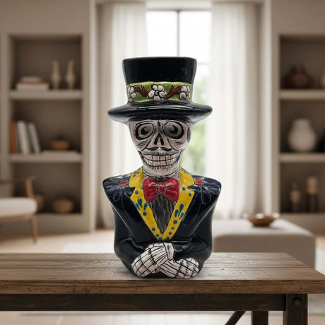 The Talavera Hub handcrafted ceramic Catrin skeleton statue with vibrant hand-painted Day of the Dead details.