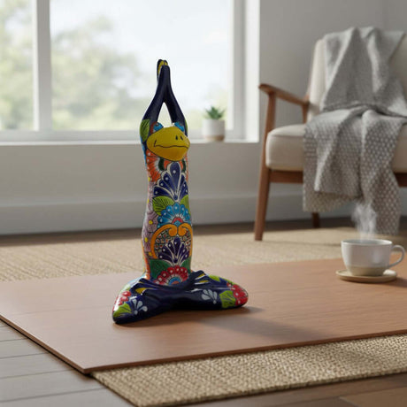 The Talavera Hub handmade Mexican ceramic yoga frog statue with colorful hand-painted floral folk art patterns.
