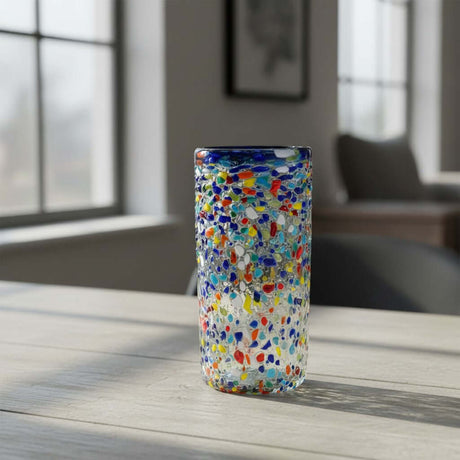 The Talavera Hub hand-blown glass tumbler with confetti chips, pebbled texture, and cobalt blue rim. 18 oz.
