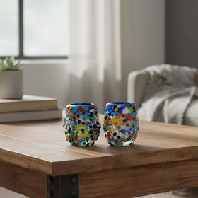 The Talavera Hub confetti rimmed shot glass with blue rim, hand-blown recycled glass with multicolor flecks.