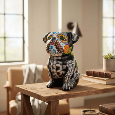 The Talavera Hub Day of the Dead bulldog figurine, hand-painted ceramic with vibrant floral and skeletal designs.