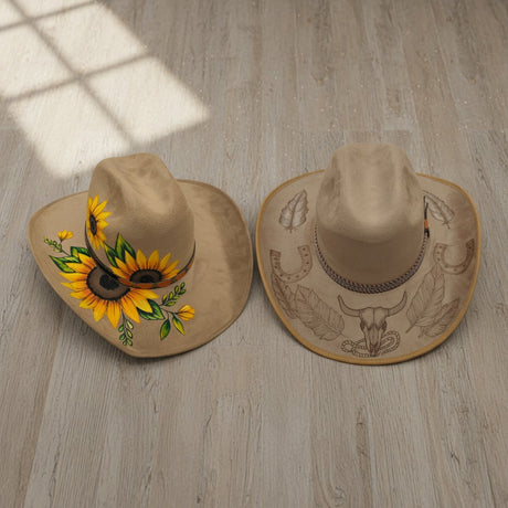 The Talavera Hub two tan cowboy hats, one with sunflowers, the other with etched bull skull and horseshoes.