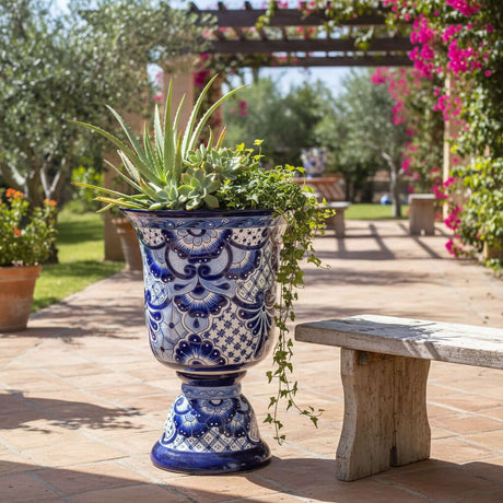 The Talavera Hub extra large hand-painted blue and white Talavera planter on a pedestal base with intricate floral patterns.