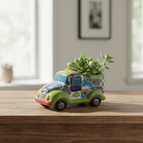 The Talavera Hub hand-painted ceramic car planter in green with colorful floral and geometric designs. Small size, ideal for succulents.