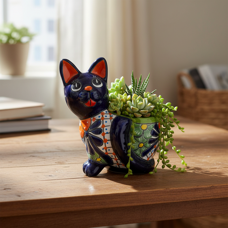 The Talavera Hub medium handmade cat planter, hand-painted blue ceramic with vibrant floral and geometric designs.