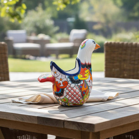 The Talavera Hub large ceramic dove planter, hand-painted with vibrant floral and geometric patterns in blue, orange, red, and yellow.