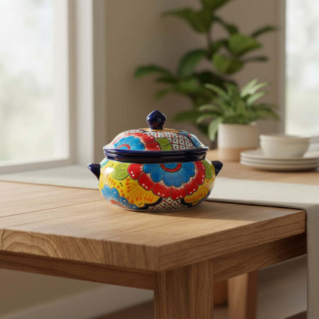 The Talavera Hub handmade ceramic soup pot with lid, featuring vibrant floral designs in blue, red, yellow, and green.