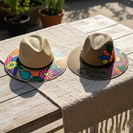 The Talavera Hub hand-painted Mexican sombrero with vibrant floral designs. Straw hat with colorful art.
