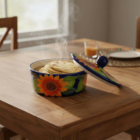 The Talavera Hub handmade cobalt blue ceramic tortilla warmer with sunflower motif and lid, 7.5" diameter.