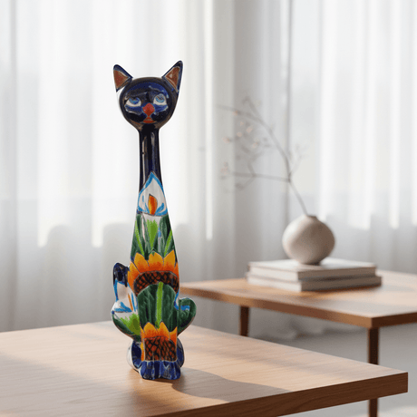 The Talavera Hub Tall Talavera Cat Statue with sunflower design, hand-painted ceramic with lead-free glaze.