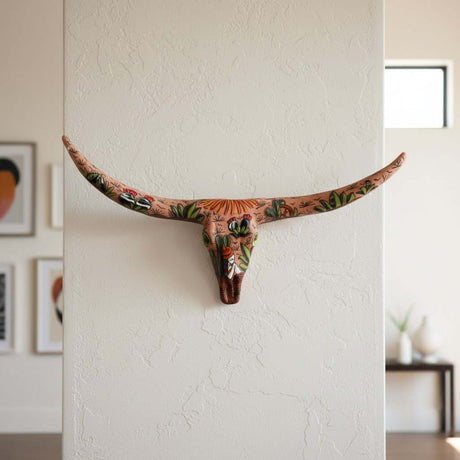 Talavera Longhorn Skull | Terracotta Desert Design mounted on a wall with colorful motifs and patterns.