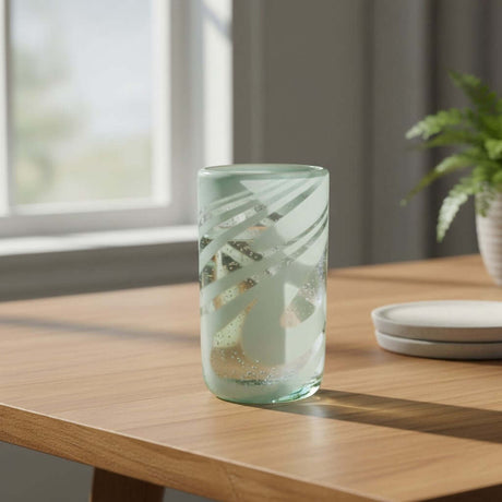 The Talavera Hub hand-blown glass drinking glass with white swirl pattern, 18 oz capacity.