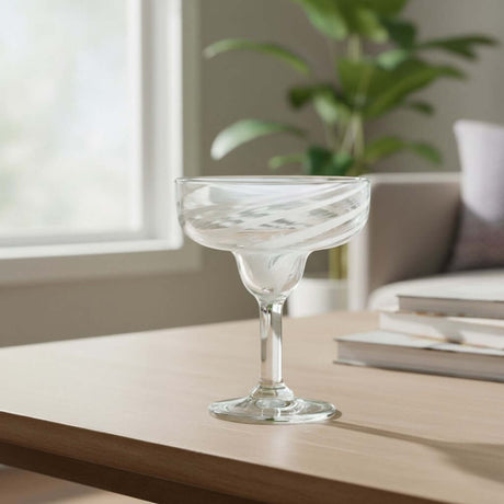 The Talavera Hub clear hand-blown margarita glass with white swirl pattern on rim and stem, 12 oz capacity.