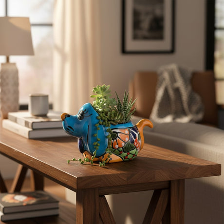 The Talavera Hub blue hand-painted Talavera dog planter with floral designs, ideal for small plants.