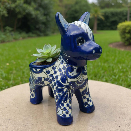 The Talavera Hub blue and white ceramic donkey planter with floral patterns. Handcrafted Mexican art.