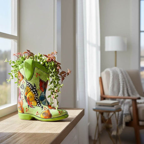 The Talavera Hub hand-painted ceramic boot planter with butterflies and flowers in vibrant colors. Small size, ideal for succulents.