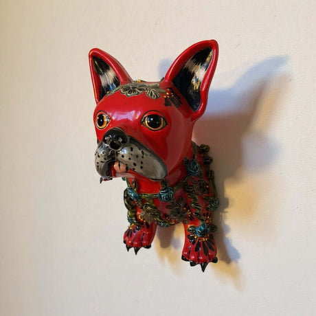 The Talavera Hub red French Bulldog statue, handcrafted ceramic with floral accents, wall art.
