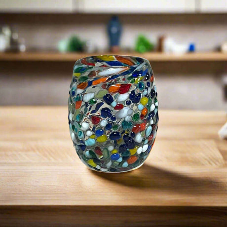 Rounded Mexican Shot Glass | Hand-Blown Mexican Confetti Glassware - colorful hand-blown rounded shot glass with multicolor confetti chips, smooth festive tumbler