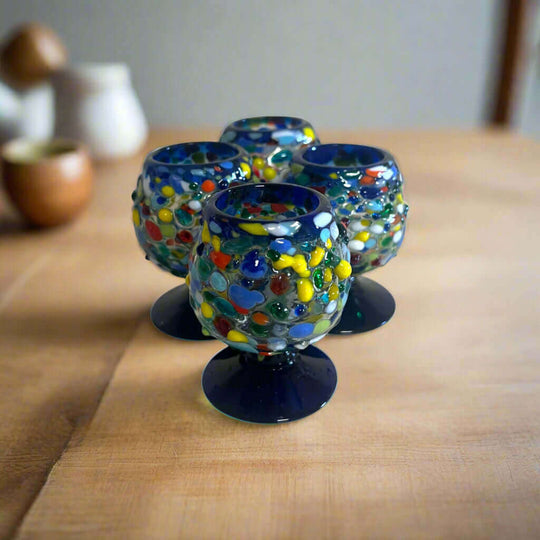 Confetti Rock Shot Glass | Blue Rim Cognac Style - hand-blown multicolored fused glass shot glass with deep blue rim and pedestal base