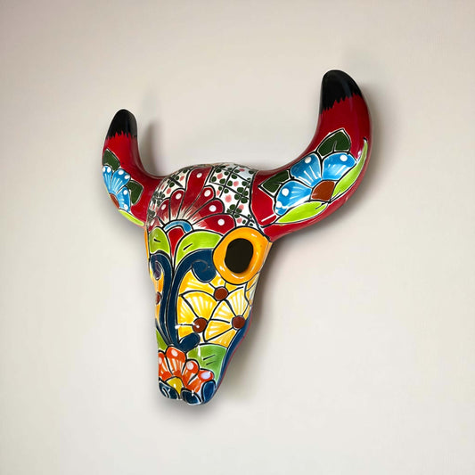 Talavera Bull Skull Wall Decor | Colorful Handcrafted Longhorn Art - hand-painted vibrant floral Talavera skull hung on wall