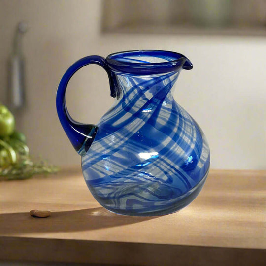 Blue Swirl Glass Pitcher | Hand-Blown Mexican Drinkware - hand-blown lead-free glass pitcher with vibrant blue swirl, artisan-made in Guanajuato